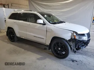 2015 Jeep Grand Cherokee Summit with VIN 1C4RJFJG1FC226591, listed as a Copart auction lot 52926115 with 130,803 mi miles and Salvage Title. Bid and sale history available at DreamBid. Image 4.