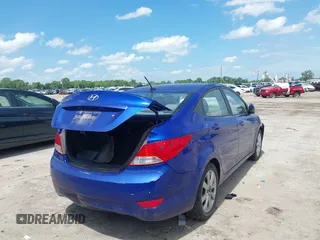 2013 Hyundai Accent GLS with VIN KMHCU4AEXDU437677, listed as a IAAI auction lot 42110350 with 144,947 mi miles. Bid and sale history available at carsss.com. Image 4.