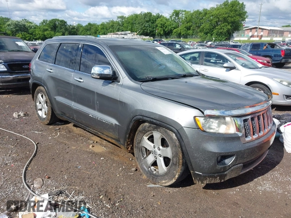 2011 Jeep Grand Cherokee Overland Summit with VIN 1J4RR6GT3BC713812, listed as a IAAI auction lot 42398585 with 208,476 mi miles and . Bid and sale history available at DreamBid. Image 1.