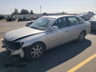 2000 Toyota Avalon XL z VIN 4T1BF28B7YU112576, wystawiony jako Copart lot #59726505 z przebiegiem 242 412 mil mil oraz Szkoda całkowita • Salvage title. Historia ofert i sprzedaży dostępna na DreamBid. Obrazek 1.