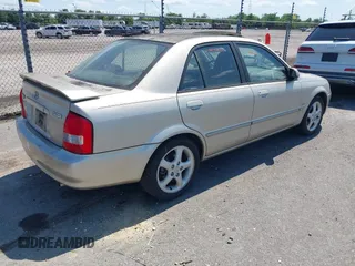 2002 Mazda Protege DX with VIN JM1BJ225820568350, listed as a IAAI auction lot 42188364 with 52,572 mi miles and . Bid and sale history available at DreamBid. Image 4.