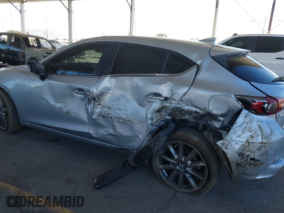 2018 Mazda 3 Touring with VIN 3MZBN1L31JM163466, listed as a IAAI auction lot 40777124 with 101,497 mi miles and . Bid and sale history available at carsss.com. Image 6.