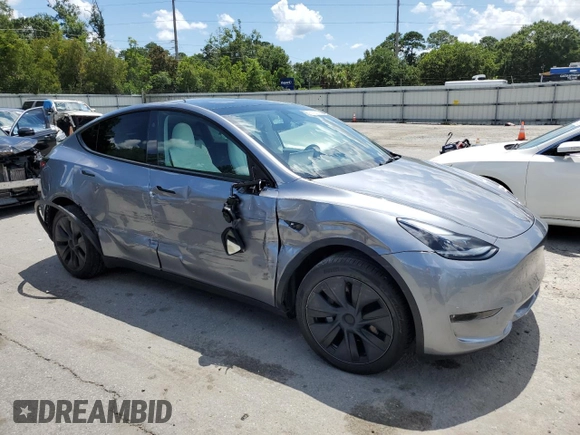 2024 Tesla Model Y Long Range z VIN 7SAYGDEE7RA308338, wystawiony jako Copart lot #61137375 z przebiegiem 19 501 mil mil oraz Szkoda całkowita • Salvage title. Historia ofert i sprzedaży dostępna na DreamBid. Obrazek 4.