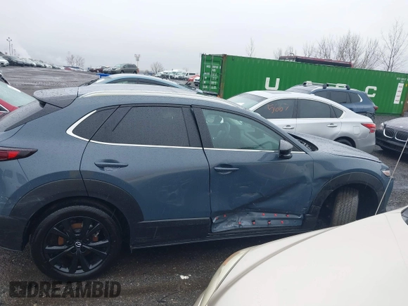 2024 Mazda CX-30 S Carbon Edition z VIN 3MVDMBCM7RM606050, wystawiony jako IAAI lot #41807459 z przebiegiem 7908 mil mil oraz . Historia ofert i sprzedaży dostępna na DreamBid. Obrazek 13.