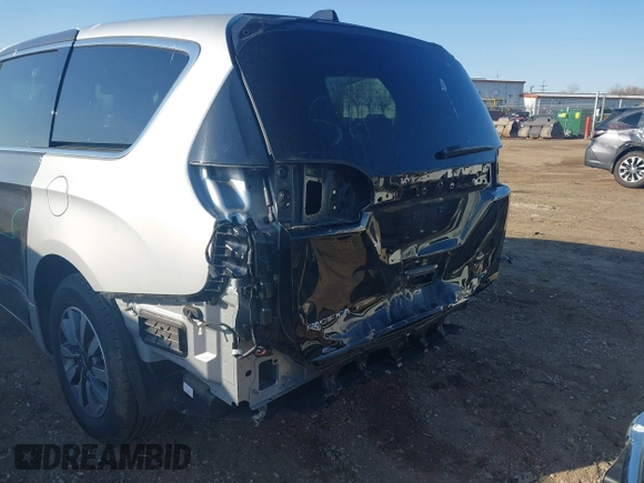 2023 Chrysler Pacifica Hybrid Limited with VIN 2C4RC1S72PR588627, listed as a IAAI auction lot 42063631 with 52,799 mi miles and . Bid and sale history available at DreamBid. Image 19.