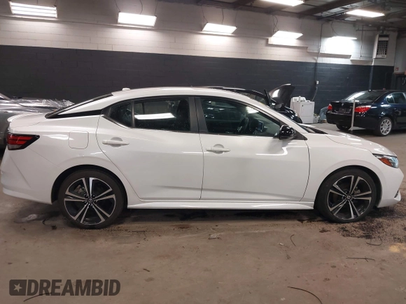 2021 Nissan Sentra SR z VIN 3N1AB8DVXMY320878, wystawiony jako IAAI lot #41911623 z przebiegiem 13 134 mil mil oraz . Historia ofert i sprzedaży dostępna na DreamBid. Obrazek 13.