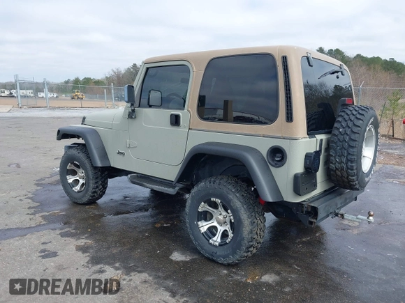 1999 Jeep Wrangler Sahara with VIN 1J4FY49S0XP480017, listed as a IAAI auction lot 41642577 with 154,068 mi miles. Bid and sale history available at carsss.com. Image 3.