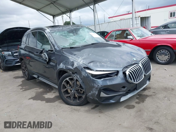 2021 BMW X1 xDrive28i with VIN WBXJG9C03M3M80011, listed as a IAAI auction lot 42137781 with 132,969 mi miles. Bid and sale history available at carsss.com. Image 1.