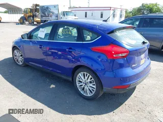 2015 Ford Focus Titanium z VIN 1FADP3N25FL291844, wystawiony jako IAAI lot #42383067 z przebiegiem 82 545 mil mil oraz . Historia ofert i sprzedaży dostępna na DreamBid. Obrazek 3.