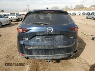 2017 Mazda CX-5 Touring z VIN JM3KFBCL7H0212955, wystawiony jako Copart lot #46096525 z przebiegiem 94 606 mil mil oraz Szkody całkowita. Historia ofert i sprzedaży dostępna na DreamBid. Obrazek 6.
