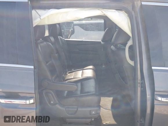 2013 Honda Odyssey Touring with VIN 5FNRL5H98DB080296, listed as a IAAI auction lot 42461843 with 104,901 mi miles and . Bid and sale history available at DreamBid. Image 8.