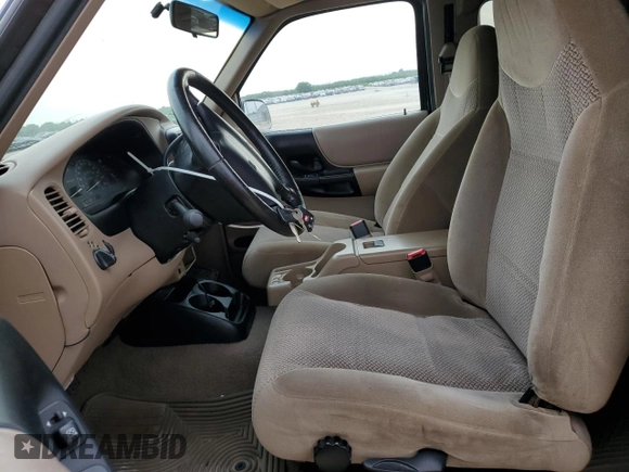 2000 Ford Ranger XLT with VIN 1FTZR15X7YPB39800, listed as a Copart auction lot 55661405 with 228,926 mi miles and Salvage title. Bid and sale history available at DreamBid. Image 7.