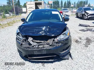 2018 Ford Focus SE z VIN 1FADP3FE5JL279274, wystawiony jako IAAI lot #42626587 z przebiegiem 92 110 mil mil oraz . Historia ofert i sprzedaży dostępna na DreamBid. Obrazek 13.