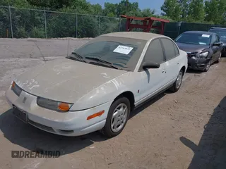 2002 Saturn SL z VIN 1G8ZK52772Z218812, wystawiony jako IAAI lot #42763871 z przebiegiem 86 338 mil mil oraz . Historia ofert i sprzedaży dostępna na DreamBid. Obrazek 2.