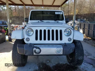 2014 Jeep Wrangler Sahara with VIN 1C4AJWBG1EL168007, listed as a Copart auction lot 87331394 with 113,228 mi miles and Salvage Title. Bid and sale history available at DreamBid. Image 5.