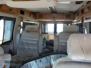 1994 Chevrolet Chevy Van z VIN 1GBEG25K9RF176079, wystawiony jako Copart lot #65824634 z przebiegiem 180 507 mil mil oraz Czysty tytuł • Clean title. Historia ofert i sprzedaży dostępna na DreamBid. Obrazek 10.