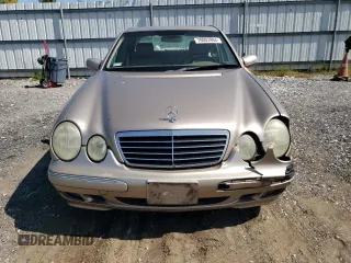 2000 Mercedes-Benz E-Class with VIN WDBJF65J2YB165568, listed as a Copart auction lot 70003994 with 146,518 mi miles and Salvage Title. Bid and sale history available at carsss.com. Image 5.