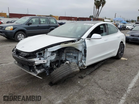 2020 Tesla Model 3 Standard Range Plus with VIN 5YJ3E1EA5LF747010, listed as a Copart auction lot 50937975 with Not Provided miles and Salvage Title. Bid and sale history available at DreamBid. Image 1.