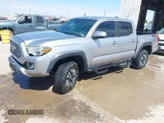 2018 Toyota Tacoma SR with VIN 3TMCZ5AN3JM170037, listed as a IAAI auction lot 42565385 with 157,450 mi miles and . Bid and sale history available at DreamBid. Image 2.
