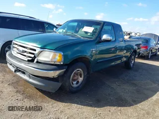 2000 Ford F-150 XL with VIN 1FTRX17L0YKA94650, listed as a IAAI auction lot 41720452 with 112,013 mi miles. Bid and sale history available at carsss.com. Image 2.