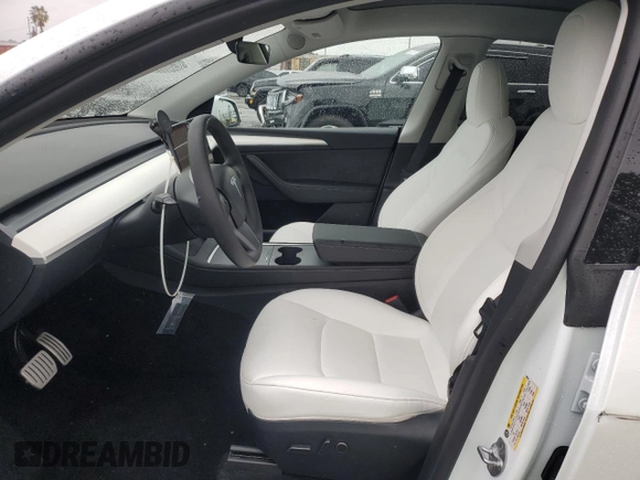 2023 Tesla Model Y Performance with VIN 7SAYGDEF1PF809654, listed as a Copart auction lot 43981915 with 16,401 mi miles and Salvage Title. Bid and sale history available at DreamBid. Image 7.