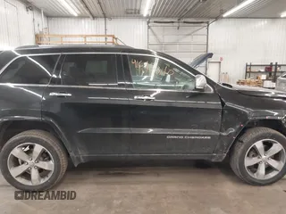 2014 Jeep Grand Cherokee Overland with VIN 1C4RJFCG8EC177899, listed as a IAAI auction lot 41695290 with 200,867 mi miles and . Bid and sale history available at DreamBid. Image 14.