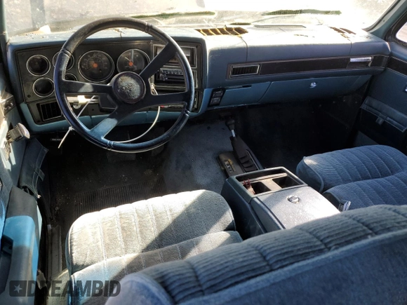 1991 GMC Suburban z VIN 1GKEV16K9MF510909, wystawiony jako Copart lot #81326004 z przebiegiem 216 778 mil mil oraz Tytuł czysty. Historia ofert i sprzedaży dostępna na DreamBid. Obrazek 8.