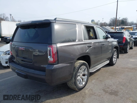 2015 GMC Yukon SLE with VIN 1GKS1AKCXFR269862, listed as a IAAI auction lot 41784763 with 156,286 mi miles. Bid and sale history available at carsss.com. Image 4.