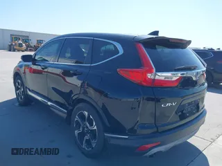 2018 Honda CR-V Touring with VIN 2HKRW2H91JH630702, listed as a IAAI auction lot 41983516 with 84,355 mi miles. Bid and sale history available at carsss.com. Image 3.
