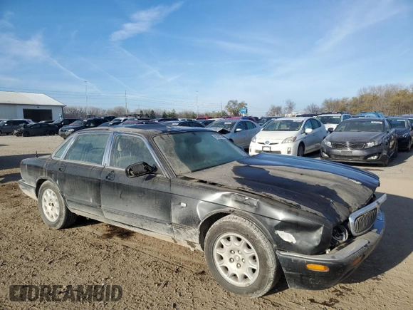1998 Jaguar XJ with VIN SAJHX1245WC819762, listed as a Copart auction lot 81480174 with 132,491 mi miles and Salvage title. Bid and sale history available at DreamBid. Image 4.
