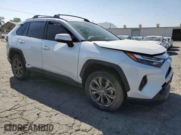 2024 Toyota RAV4 Hybrid XLE Premium with VIN JTMB6RFV6RD120633, listed as a Copart auction lot 57620825 with 28,817 mi miles and Salvage title. Bid and sale history available at DreamBid. Image 4.