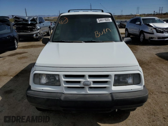 1996 Geo Tracker z VIN 2CNBE1364T6909947, wystawiony jako Copart lot #54411835 z przebiegiem 171 862 mil mil oraz Szkoda całkowita • Salvage title. Historia ofert i sprzedaży dostępna na DreamBid. Obrazek 5.