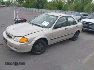 2000 Mazda Protege DX with VIN JM1BJ2227Y0237323, listed as a IAAI auction lot 42179683 with Not Provided miles and . Bid and sale history available at DreamBid. Image 2.
