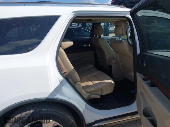 2014 Dodge Durango Limited with VIN 1C4RDJDGXEC323129, listed as a IAAI auction lot 42318727 with 148,451 mi miles and . Bid and sale history available at DreamBid. Image 8.