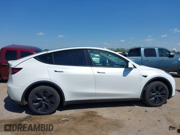 2024 Tesla Model Y with VIN 7SAYGDED0RA327806, listed as a IAAI auction lot 42096752 with 13,244 mi miles and . Bid and sale history available at DreamBid. Image 13.