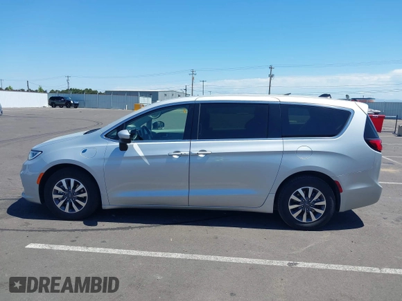 2023 Chrysler Pacifica Hybrid Touring L with VIN 2C4RC1L75PR614460, listed as a IAAI auction lot 42628545 with 68,668 mi miles and . Bid and sale history available at DreamBid. Image 14.