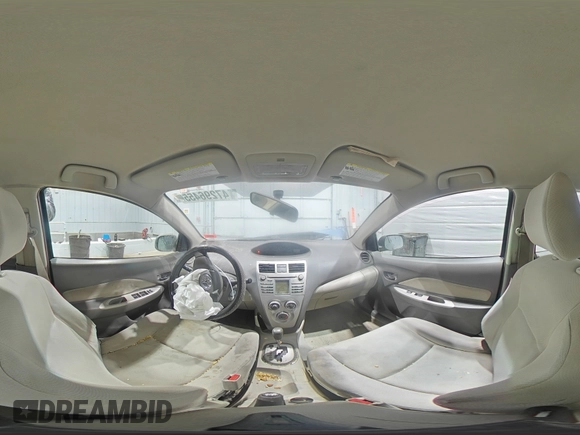 2009 Toyota Yaris with VIN JTDBT903094047243, listed as a Copart auction lot 47296455 with 235,483 mi miles and Salvage Title. Bid and sale history available at DreamBid. Image 12.