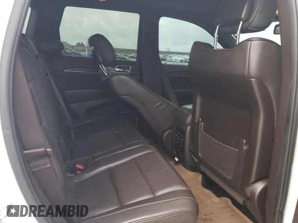 2015 Jeep Grand Cherokee Summit with VIN 1C4RJEJG8FC131925, listed as a Copart auction lot 55270785 with 130,425 mi miles and Salvage title. Bid and sale history available at DreamBid. Image 11.