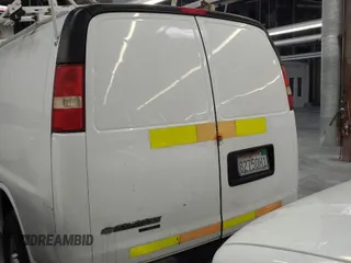 2013 Chevrolet Express Cargo Van with VIN 1GCWGFCAXD1142255, listed as a IAAI auction lot 41977242 with 194,897 mi miles. Bid and sale history available at carsss.com. Image 1.