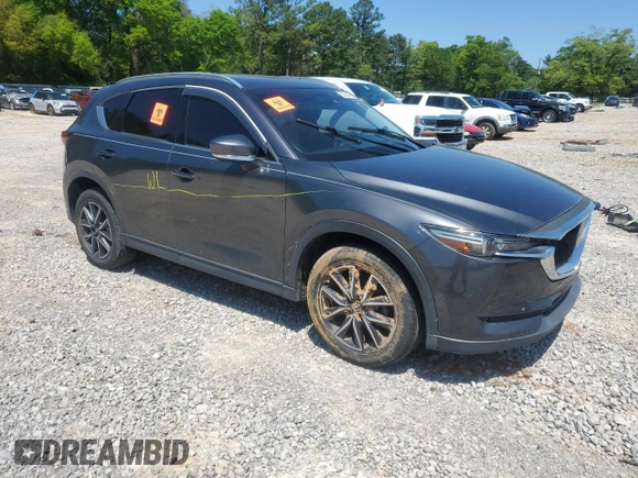 2018 Mazda CX-5 Grand Touring with VIN JM3KFADM9J0343621, listed as a Copart auction lot 52284475 with 129,776 mi miles and Salvage Title. Bid and sale history available at DreamBid. Image 4.