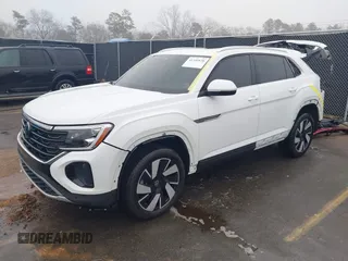 2024 Volkswagen Atlas SE z VIN 1V2JE2CA9RC238428, wystawiony jako IAAI lot #41340830 z przebiegiem 6 992 mil mil oraz . Historia ofert i sprzedaży dostępna na DreamBid. Obrazek 2.