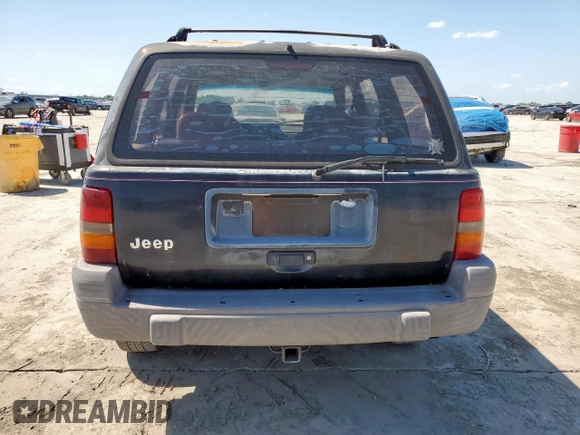 1995 Jeep Grand Cherokee Laredo z VIN 1J4FX58S9SC534442, wystawiony jako Copart lot #61233725 z przebiegiem 363 688 mil mil oraz Szkoda całkowita • Salvage title. Historia ofert i sprzedaży dostępna na DreamBid. Obrazek 6.