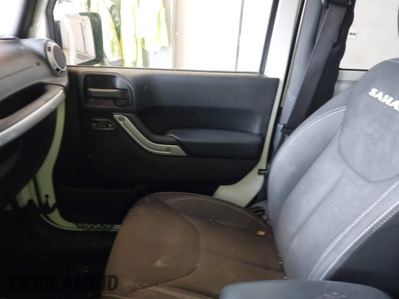 2015 Jeep Wrangler Sahara with VIN 1C4AJWBG7FL648621, listed as a IAAI auction lot 42439781 with 107,148 mi miles and . Bid and sale history available at DreamBid. Image 5.