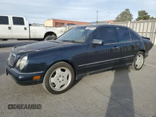 1997 Mercedes-Benz E-Class with VIN WDBJF72F8VA204316, listed as a Copart auction lot 84684614 with 203,748 mi miles and Salvage Title. Bid and sale history available at carsss.com. Image 1.
