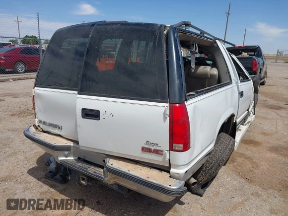 1999 GMC Suburban with VIN 1GDFK16R0XJ728255, listed as a IAAI auction lot 42230595 with Not provided miles and . Bid and sale history available at DreamBid. Image 4.