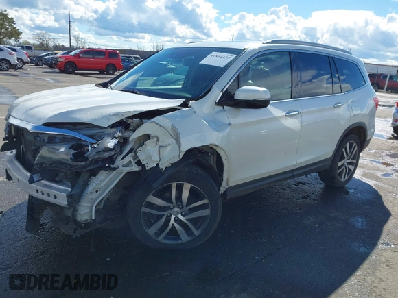 2017 Honda Pilot Elite with VIN 5FNYF6H06HB041609, listed as a IAAI auction lot 41804477 with 134,535 mi miles and . Bid and sale history available at DreamBid. Image 2.
