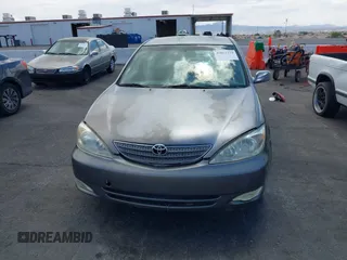 2003 Toyota Camry LE with VIN JTDBE32K130149032, listed as a IAAI auction lot 42063174 with 241,424 mi miles and . Bid and sale history available at DreamBid. Image 6.