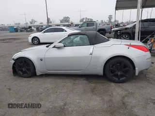 2006 Nissan 350Z Touring with VIN JN1AZ36A36M450659, listed as a IAAI auction lot 42034870 with 77,544 mi miles. Bid and sale history available at carsss.com. Image 14.