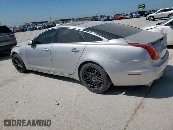 2012 Jaguar XJ with VIN SAJWA1CB0CLV23002, listed as a Copart auction lot 52804915 with 149,331 mi miles and Salvage title. Bid and sale history available at DreamBid. Image 2.