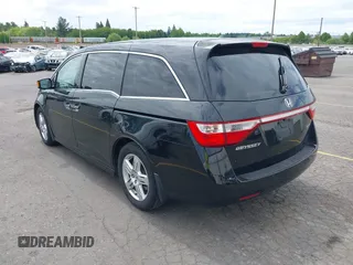 2012 Honda Odyssey Touring with VIN 5FNRL5H93CB121190, listed as a IAAI auction lot 42223998 with 154,358 mi miles and . Bid and sale history available at DreamBid. Image 3.
